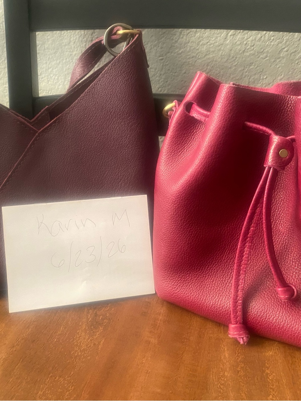 Two Portland leather bags: orchid small bucket and plum small Naomi